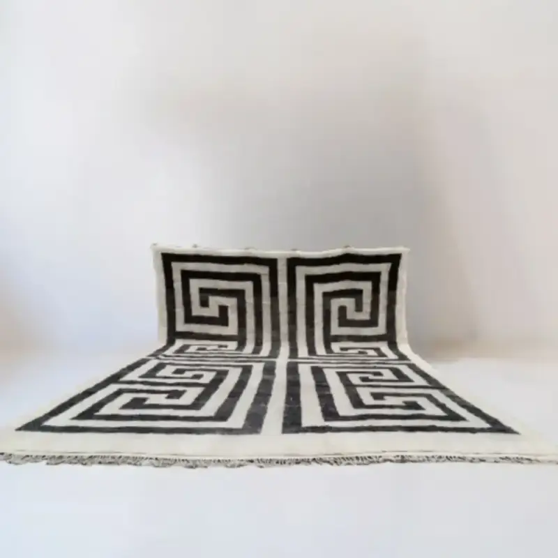 A luxurious black-and-white Beni Mrirt designer rug featuring a bold geometric labyrinth pattern, handwoven with premium Moroccan wool.