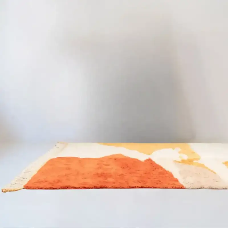 Solscape - Moroccan Beni Mrirt rug with an abstract sunlit design in warm tones of orange, yellow, and beige, handcrafted with premium wool