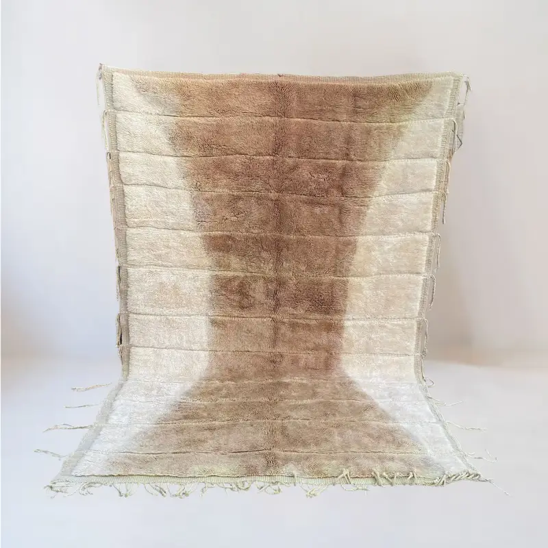 A luxurious handmade Beni Mrirt wool rug with a warm gradient of golden brown and ivory tones, featuring a soft, plush texture and a unique horizontal woven effect.