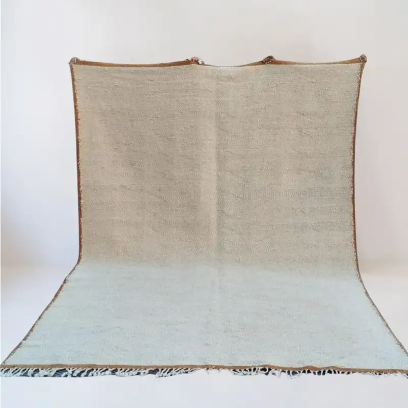 Handwoven Beni Mrirt Kilim rug, crafted from 100% natural wool using traditional Moroccan techniques. Features a textured design, making it a perfect addition to Scandinavian interiors.