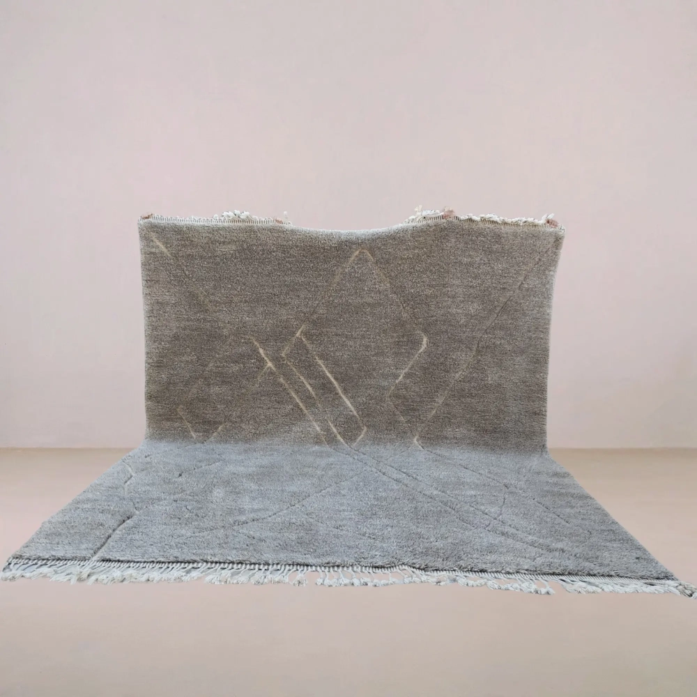 Handmade Moroccan Beni Mrirt rug in soft gray tones with a geometric design, crafted from premium wool for a plush and luxurious feel.