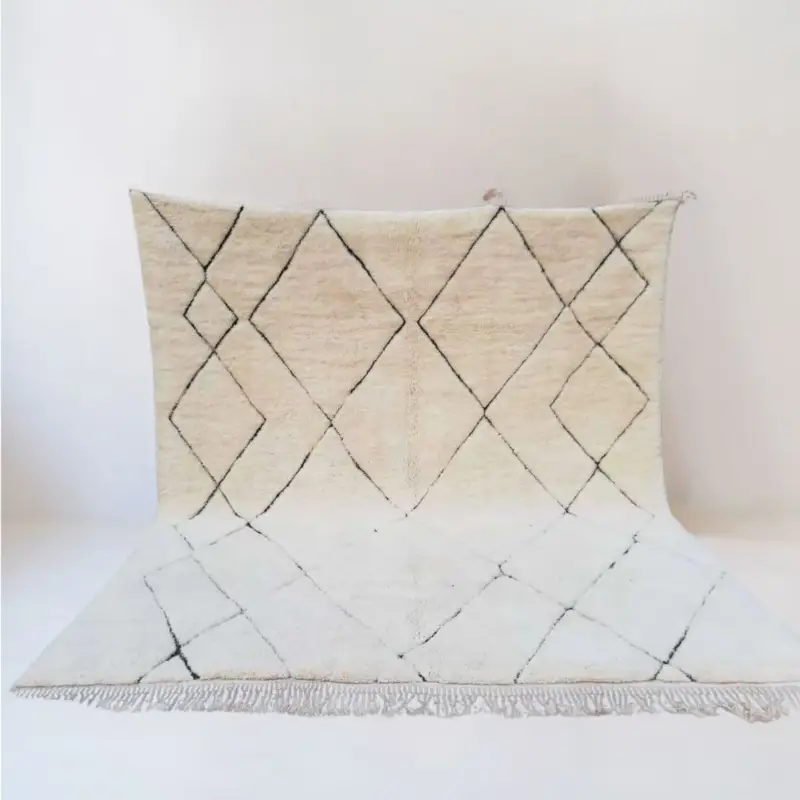 Handmade Moroccan Beni Mrirt rug featuring an intricate diamond pattern in ivory and black, symbolizing roots, growth, and cultural heritage.