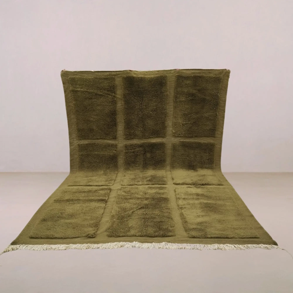 Handwoven Moroccan Beni Mrirt rug in a deep olive-green hue, featuring a modern grid design and plush high-pile texture, crafted from premium wool.